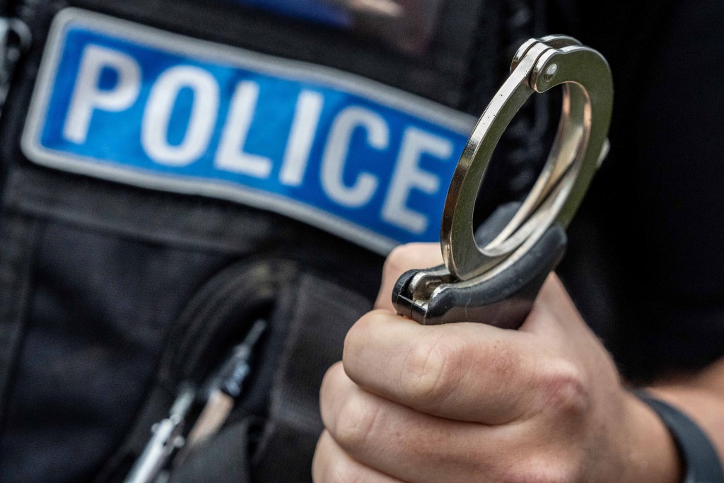 Handcuffs in a hand