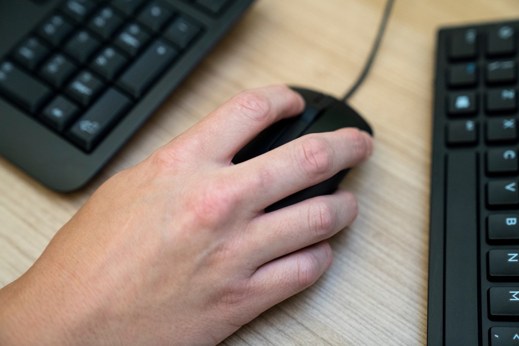 A hand on a mouse