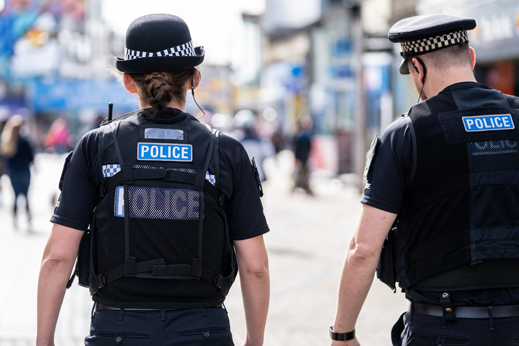 Male and female uniformed officers on patrol