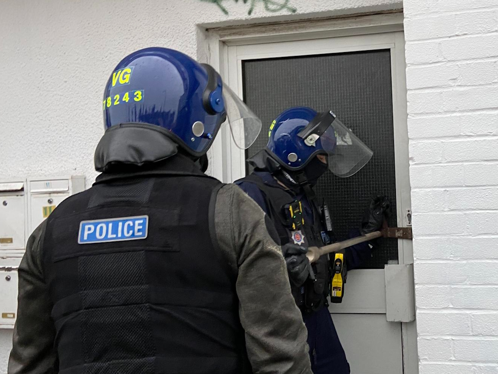 Officers carrying out a warrant in Southend