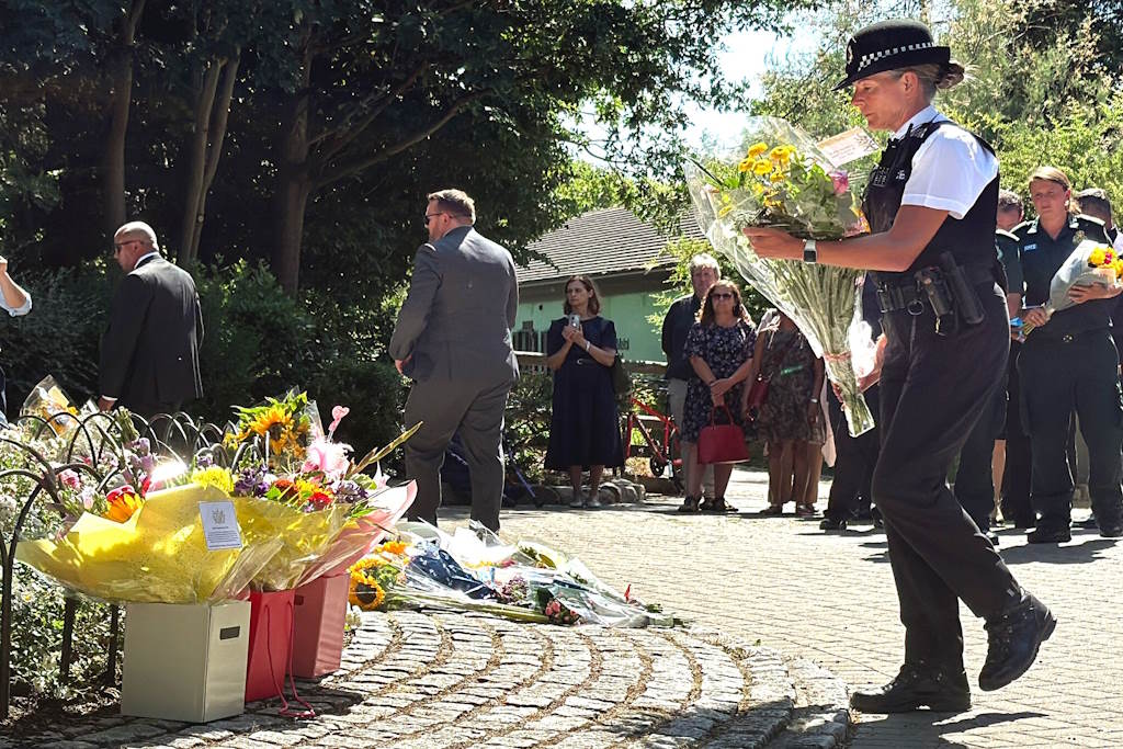 Officer lays flowers - Copy