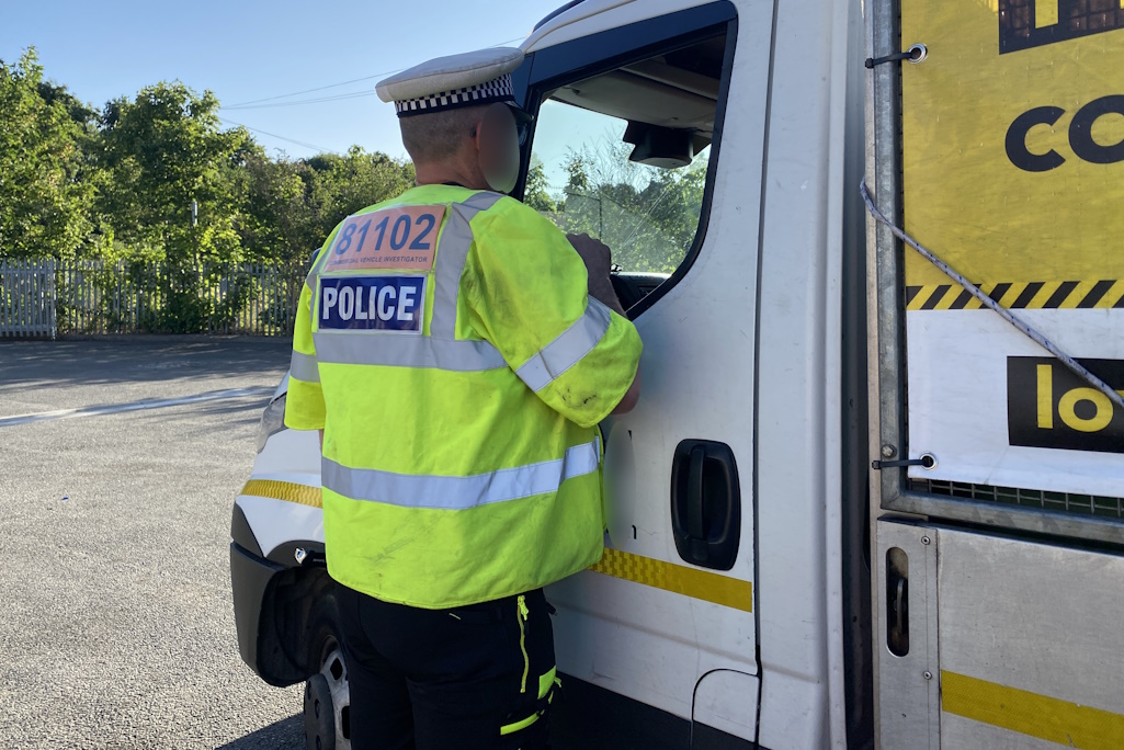 Essex Police officer talking to HGV driver