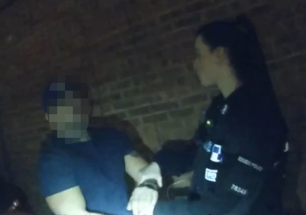 A man is handcuffed.