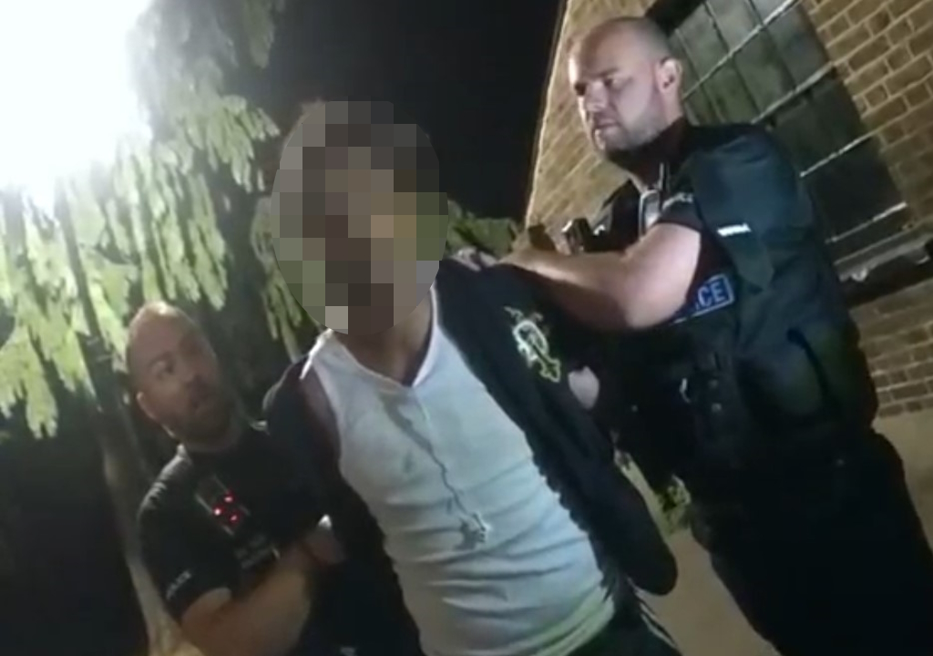 Officers arrest a suspect in the town.