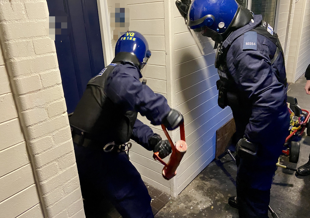 Officers force entry.