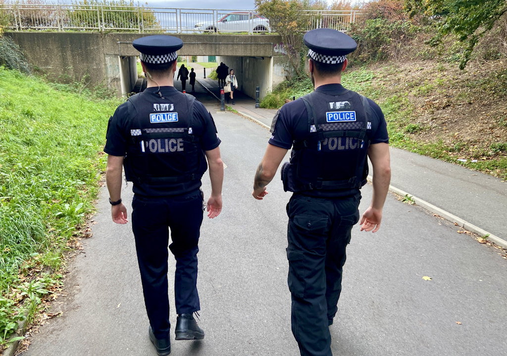 Two officers patrol Nicholls Field, Harlow.