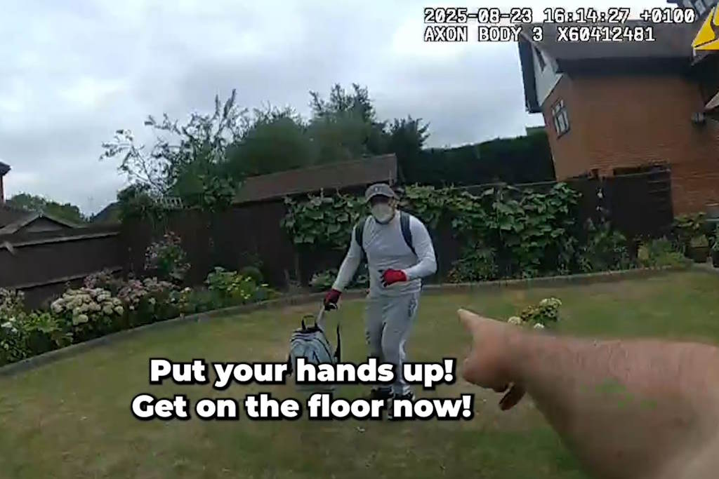 A masked and gloved man carrying a bag captured on Body Worn Video