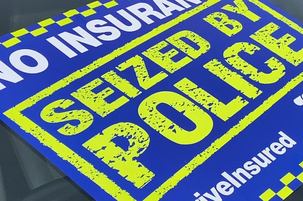 Uninsured vehicles - sticker in car window