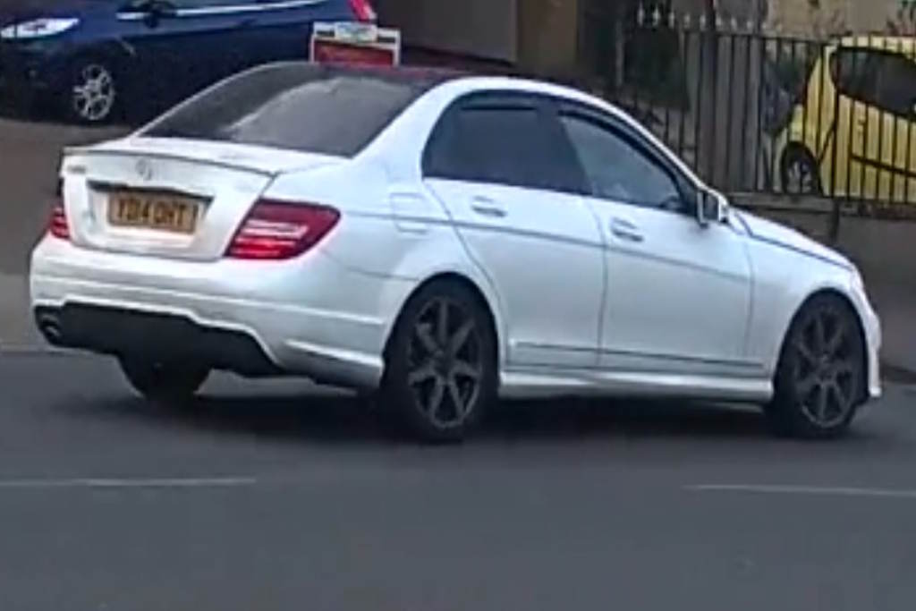 A white Mercedes car