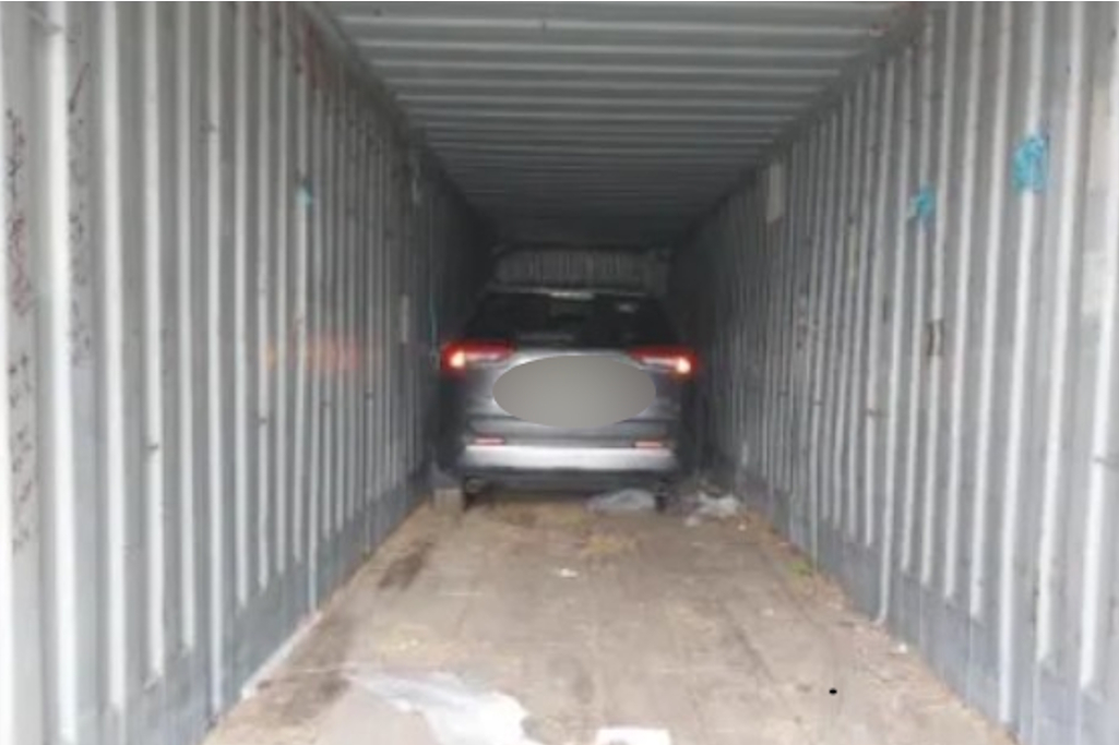 Stolen car found hidden in van