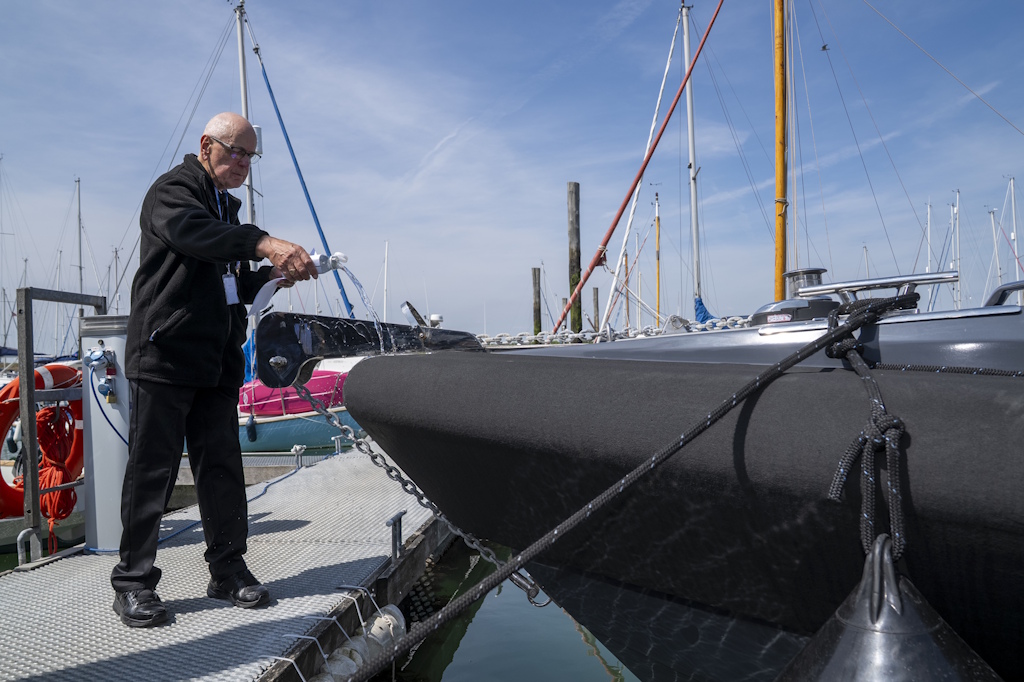 An Essex Police chaplain blesses the bow of a police launch 