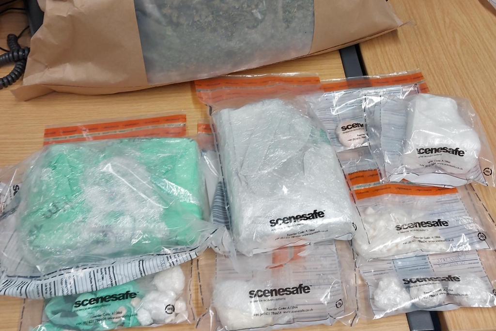 Various quantities of cocaine inside police evidence bags