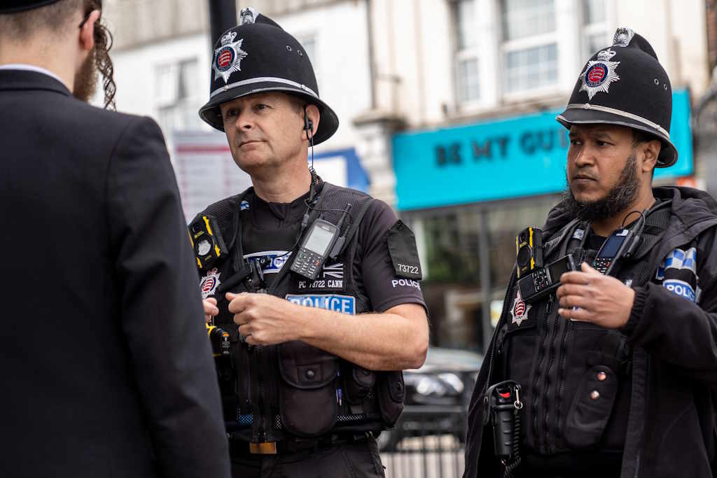An image of two police officers speaking with a member of the Jewish community in Essex