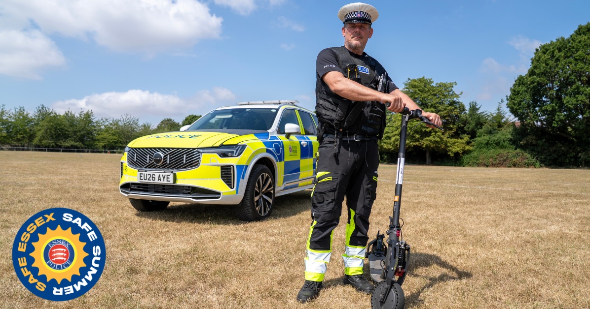 An image of an Essex Police officer holding an e-scooter on private land