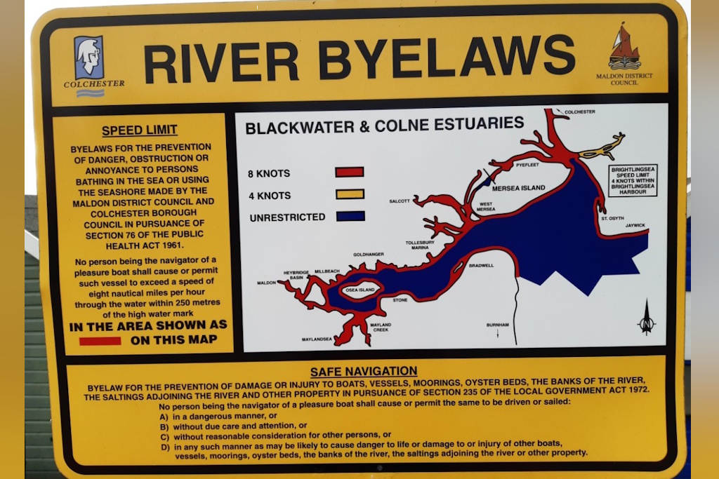A board with a map of the Blackwater and Colne estuaries showing the river byelaws and outlining the applicable water speed limits
