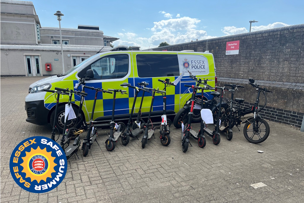 Seized e-scooters in front of a police van