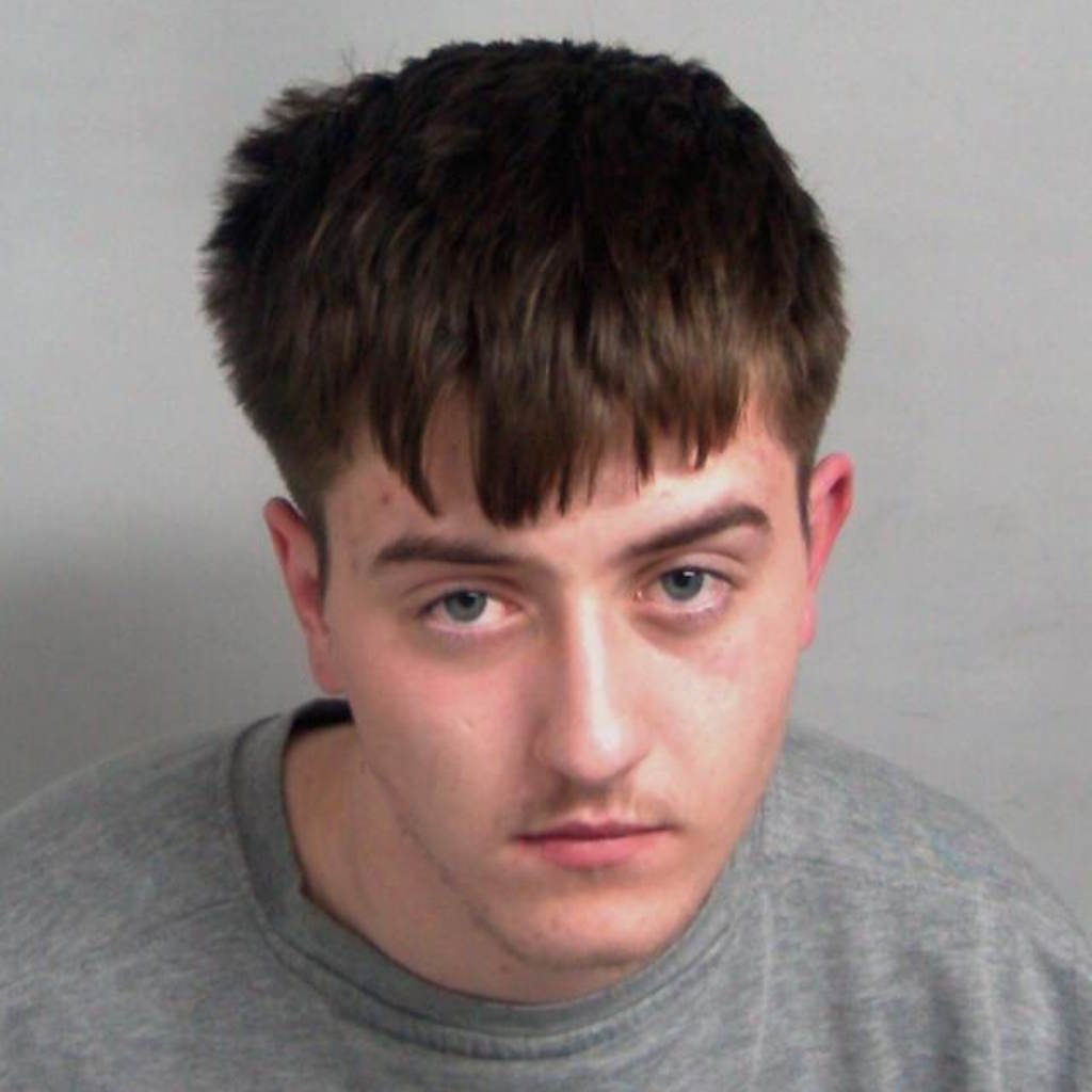 Mugshot shows white man looking at the camera. He has short brown hair.