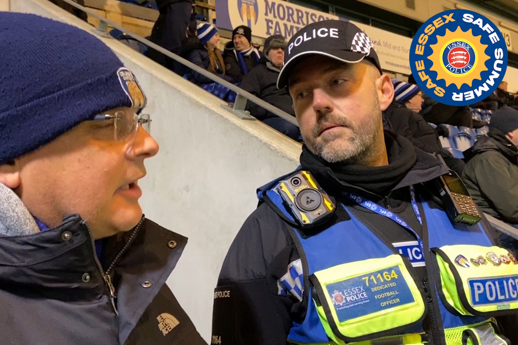 A uniformed Essex Police dedicated football officer in a high-visibility vest
