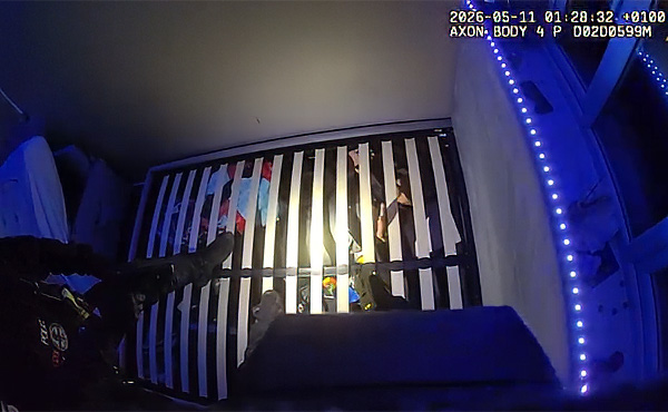Joseph Wicks hiding under bed