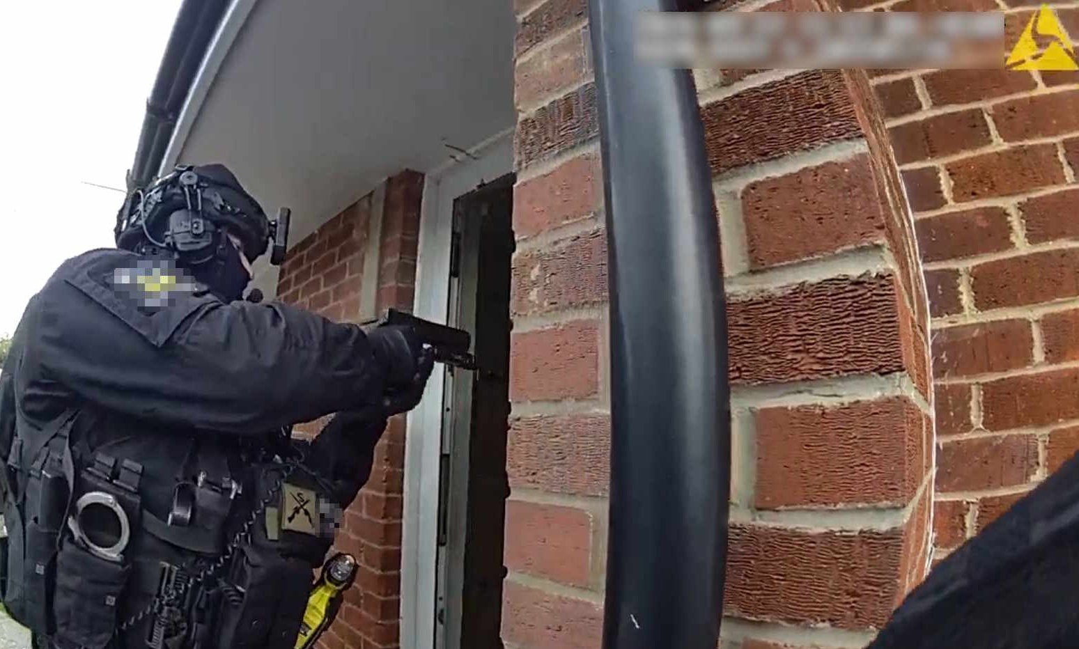 An image of an officer going into a home in Benfleet
