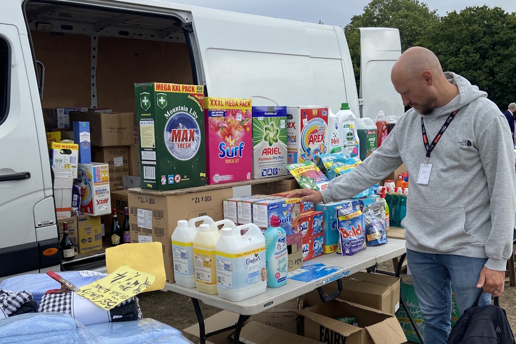 An Essex Police business crime officer in plain clothes inspects detergents and other laundry items on a stall at a car boot sale. There is no suggestion any of the goods pictured are being sold illegally