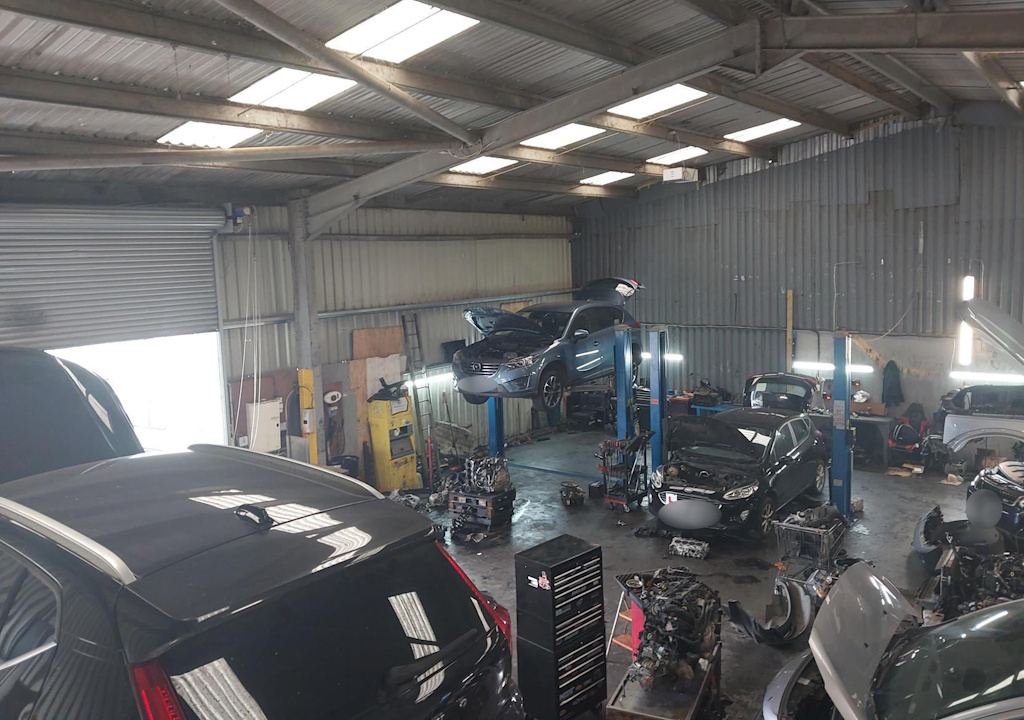 Cars in an industrial unit.