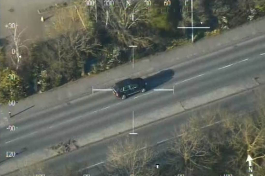 A black car as seen from a helicopter above